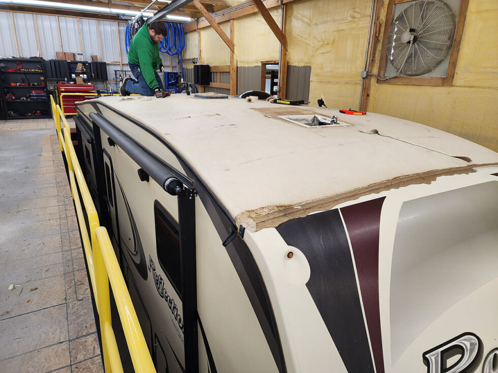 fifth wheel rv roof being repaired