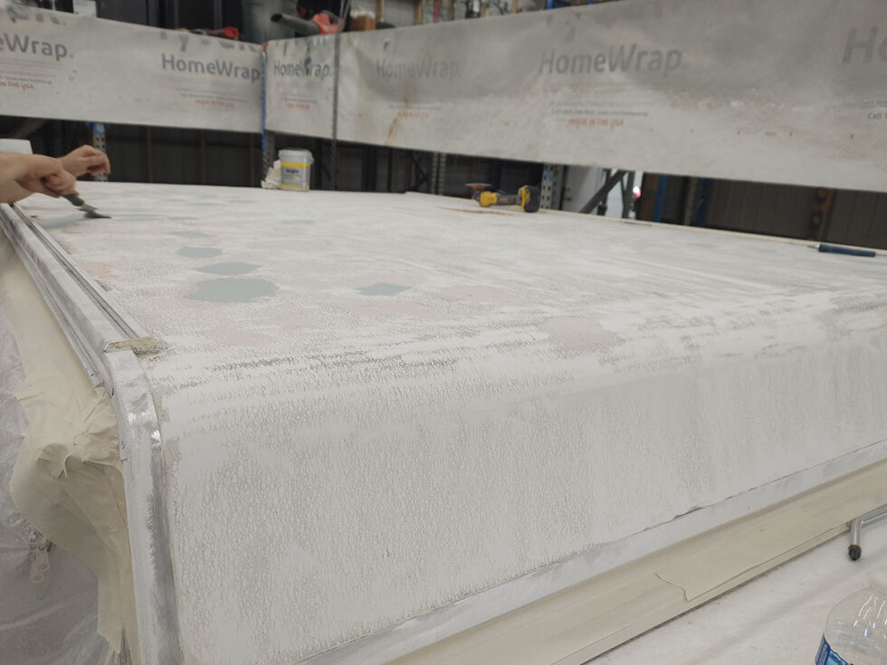 Pop Up camper having roof repaired after hail damage