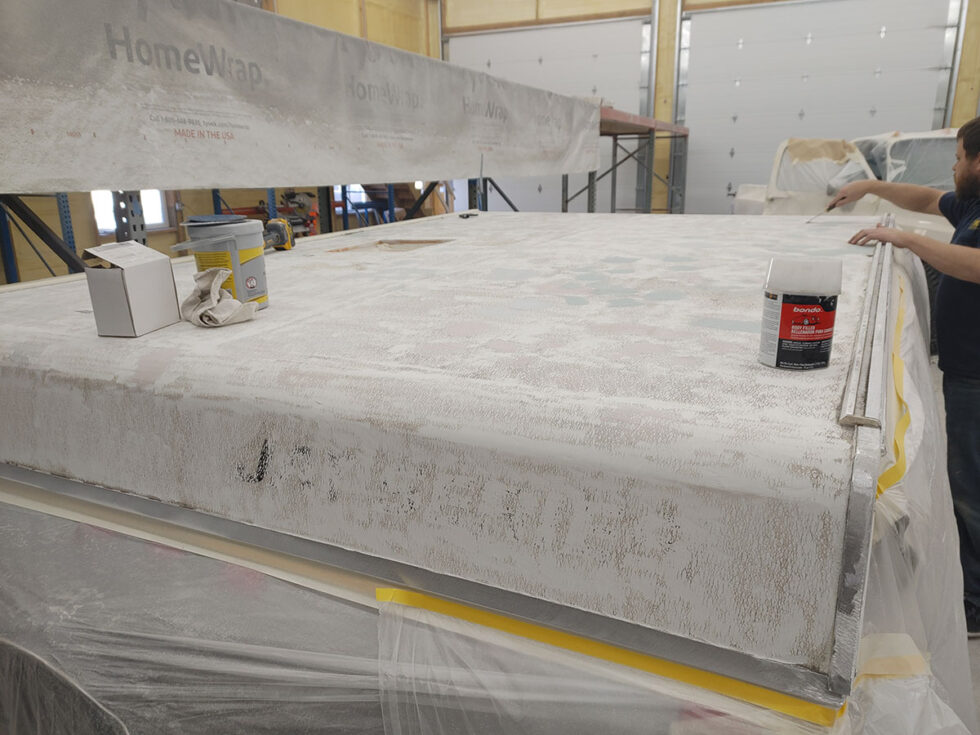 Pop Up camper having roof repaired after hail damage