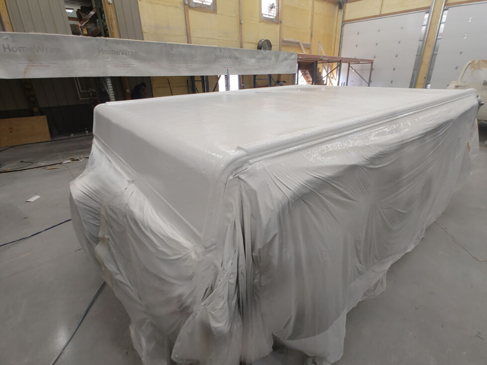 Pop Up camper having roof repaired after hail damage