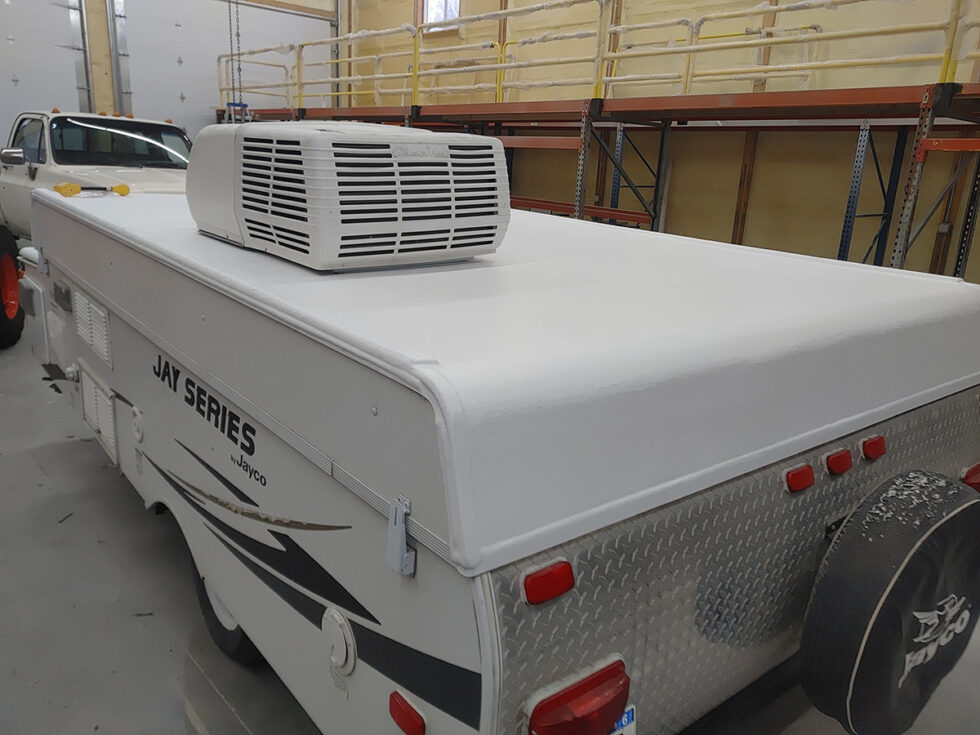 Pop Up camper having roof repaired after hail damage