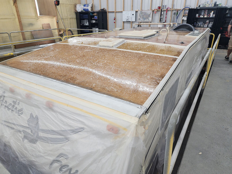Truck camper roof being repaired