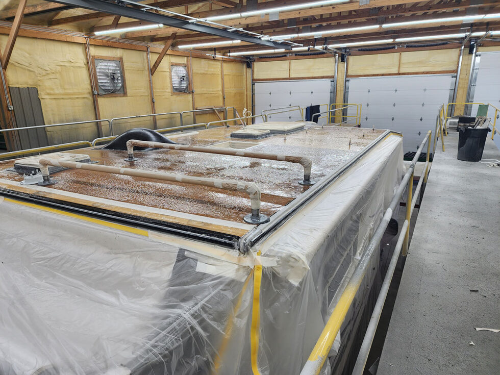 Truck camper roof being repaired