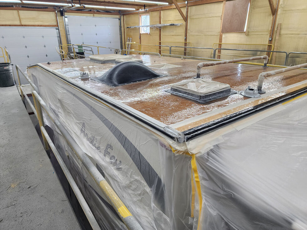 Truck camper roof being repaired