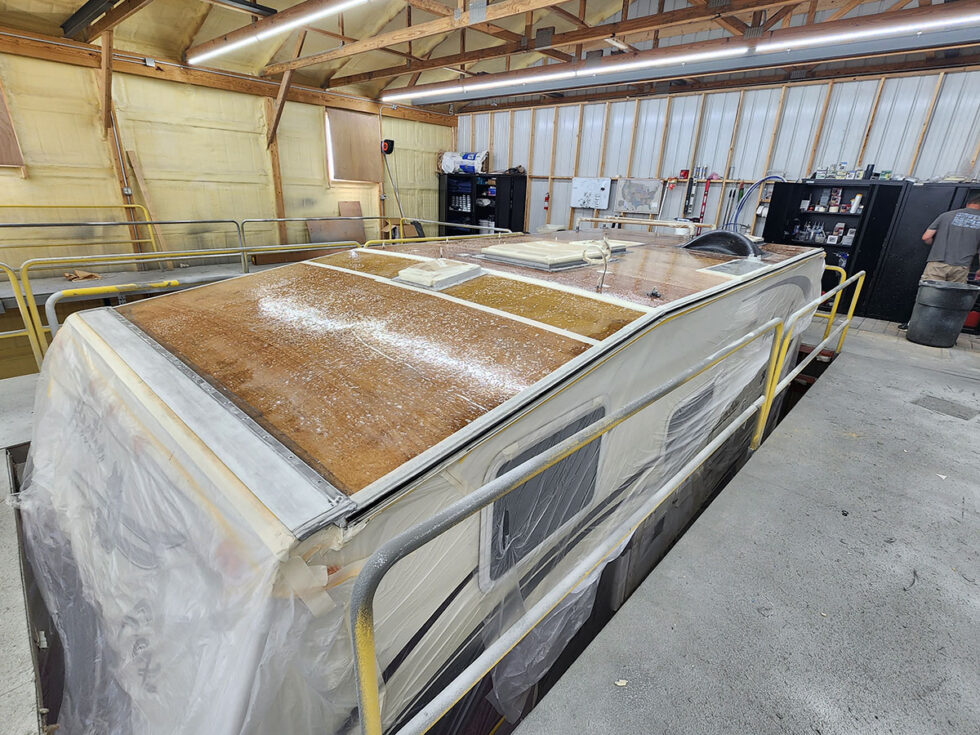 Truck camper roof being repaired