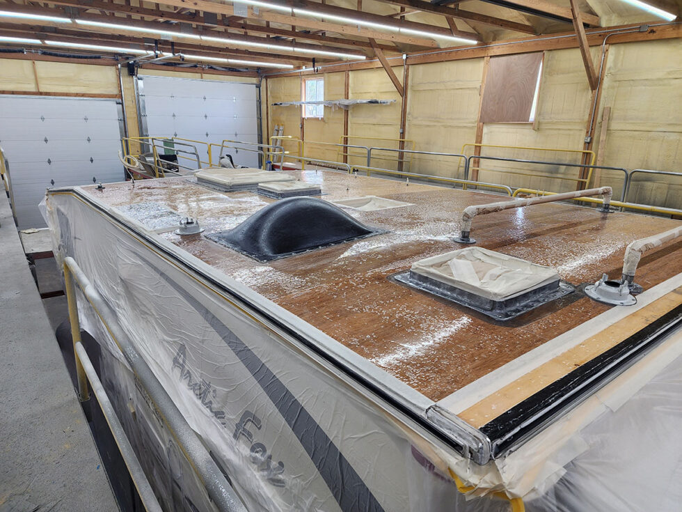 Truck camper roof being repaired