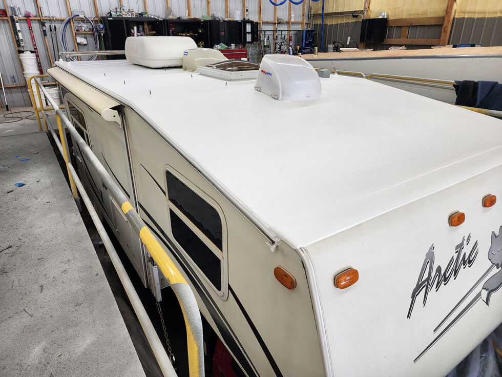 Truck camper roof being repaired