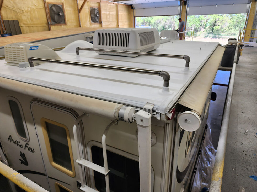 Truck camper roof being repaired