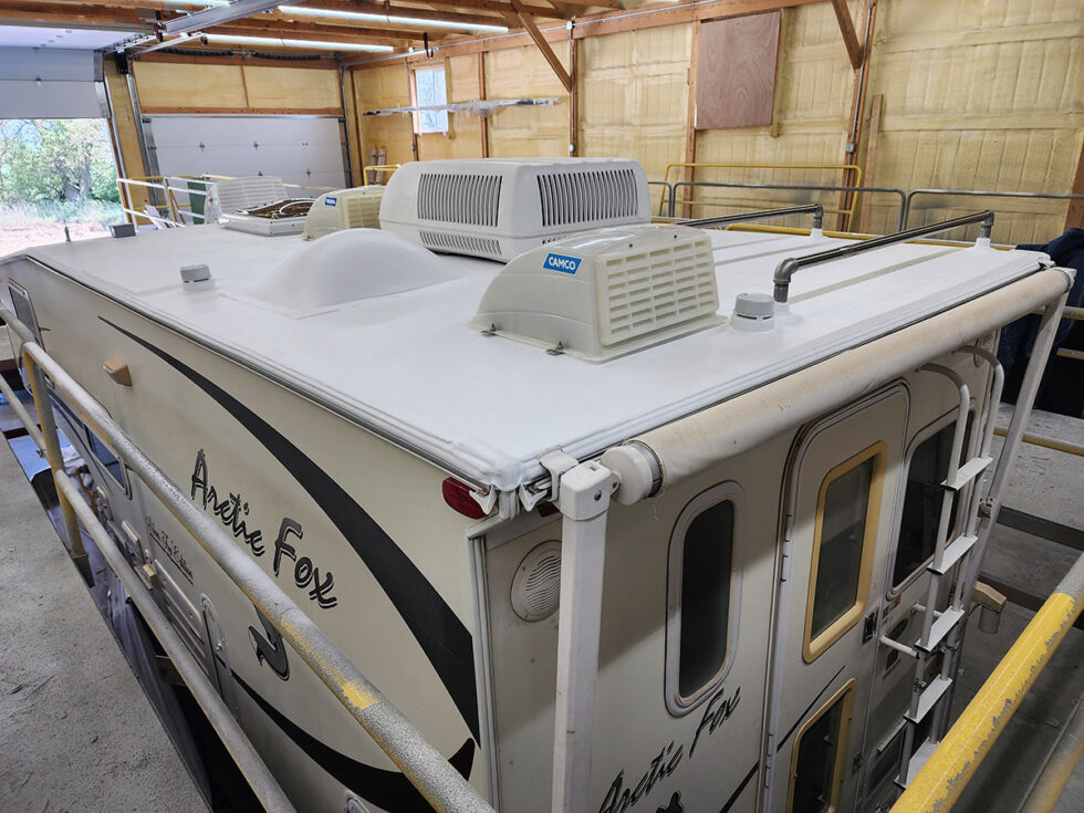 Truck camper roof being repaired