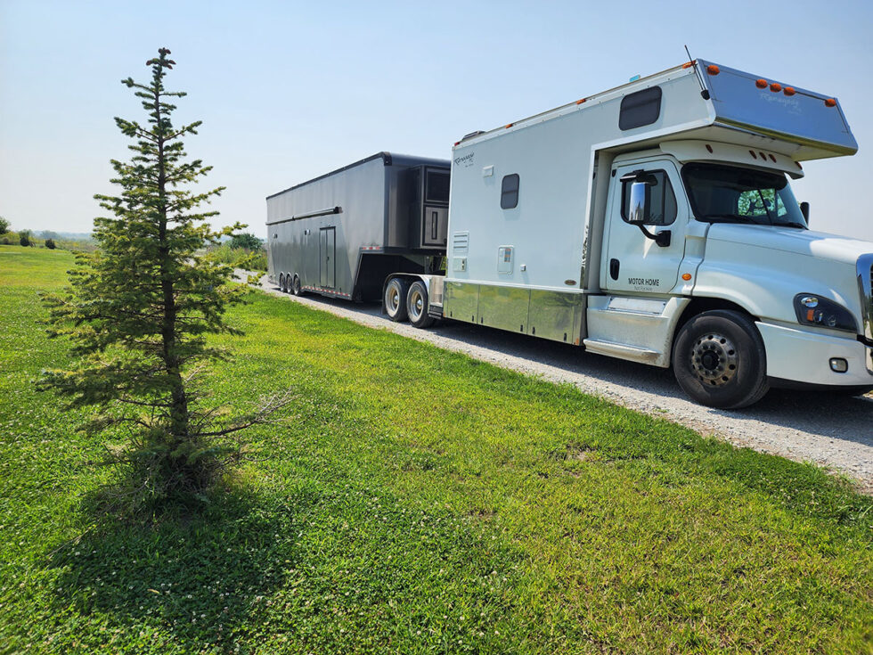 custom race car trailer pulling in for a new roof