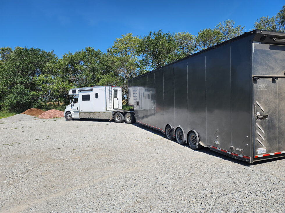 custom race car trailer pulling in for a new roof