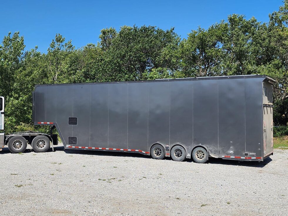 custom race car trailer pulling in for a new roof