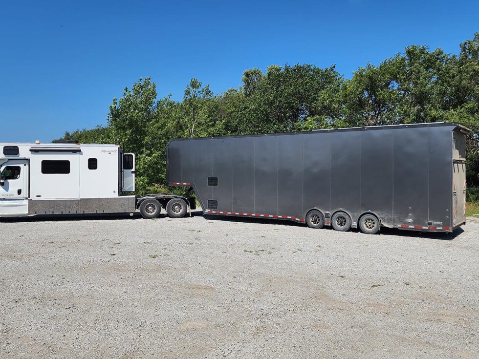custom race car trailer pulling in for a new roof