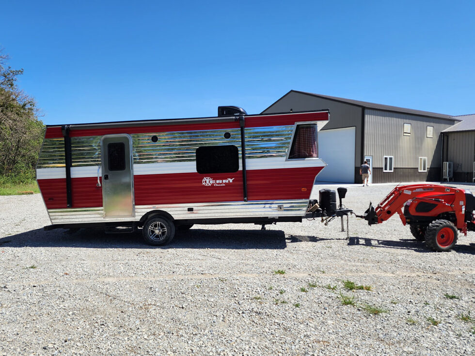 red and chrome terry classic rv from the side