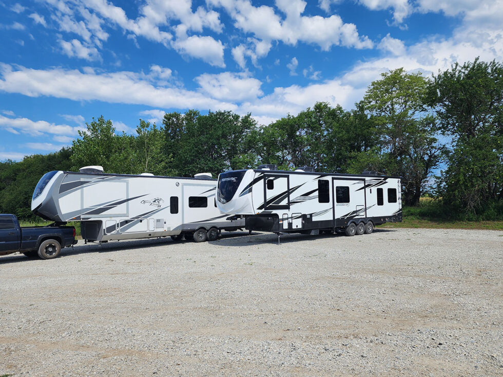 two RVs in parking lot