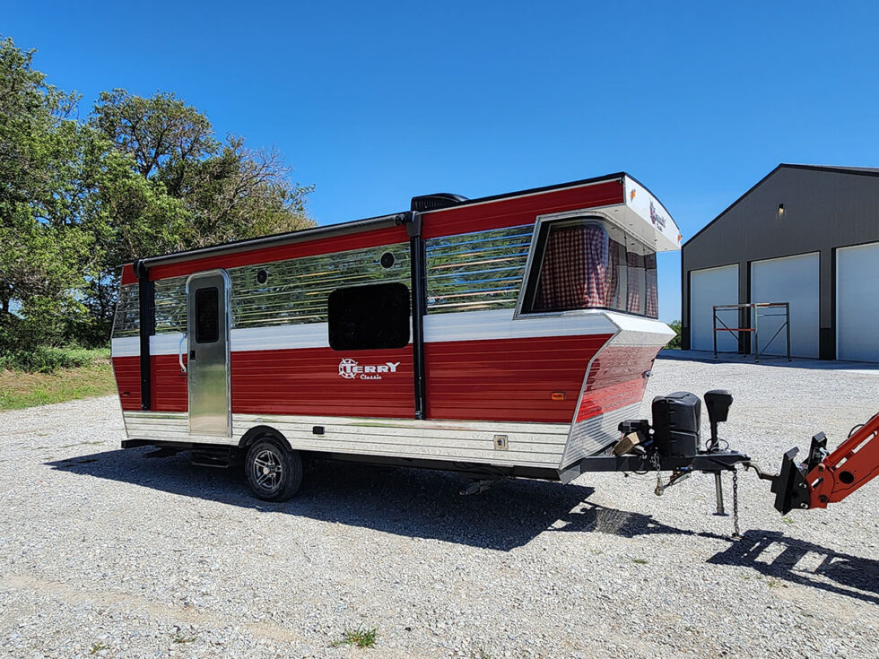 red and chrome terry classic rv from the side