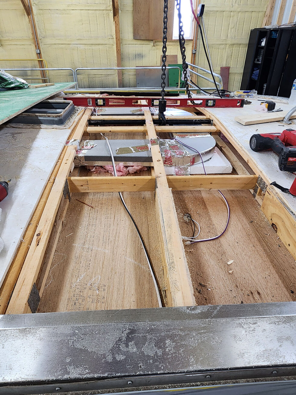 damaged RV in shop for a new roof