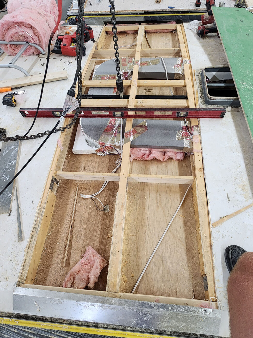 damaged RV in shop for a new roof