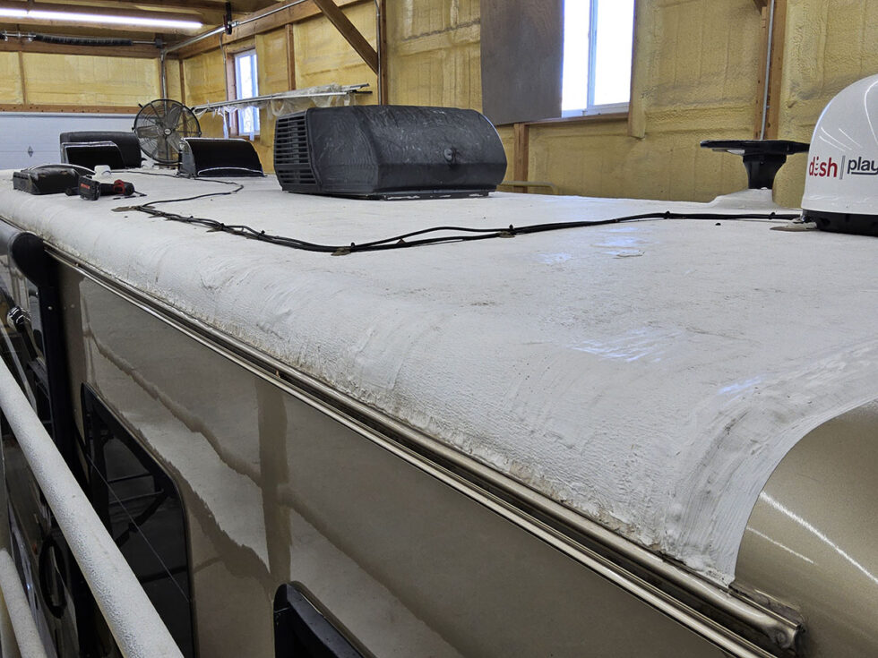 rv roof with patches from hail damage