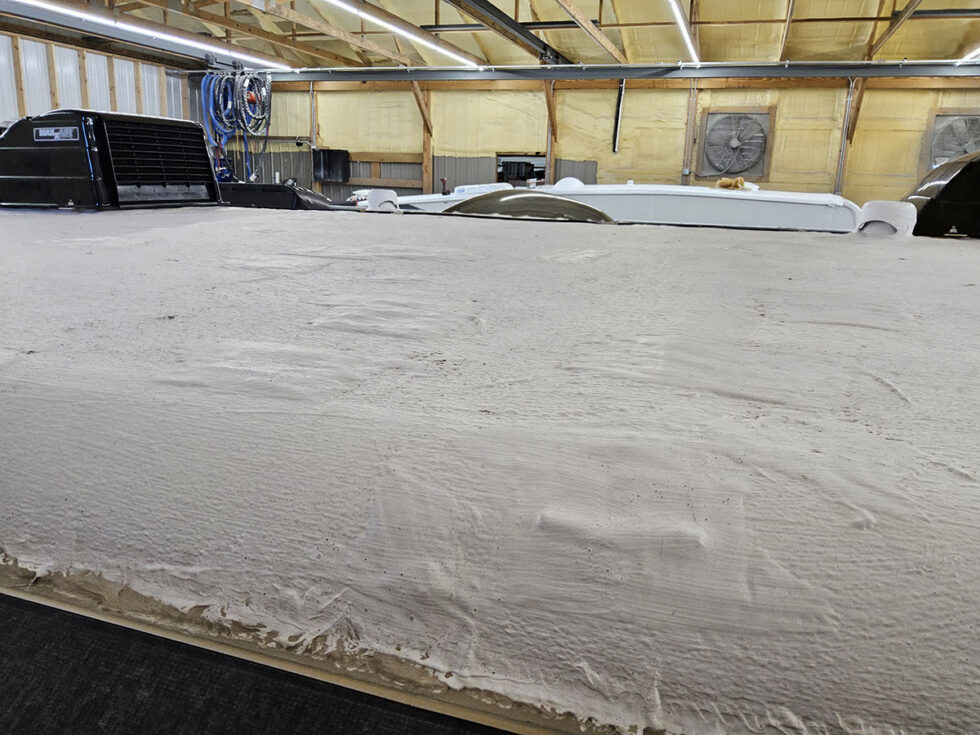 rv roof with patches from hail damage