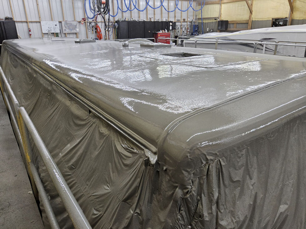 rv roof being sprayed with FlexArmor after hail damage repairs