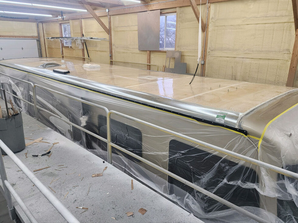 rv roof being repaired after hail damage